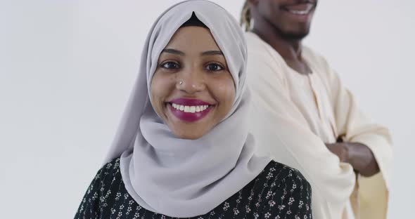 Portrait of Affrican Couple in Traditional Islamic Clothes Against White Backgorund