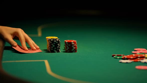 Poker Player Betting Chips and Keys to House, Going All-In, Gambling Addiction