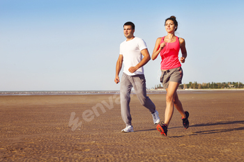 Runners training outdoors working out in nature