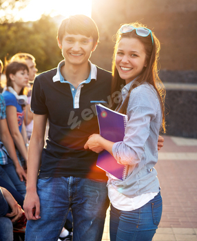 Group of students or teenagers with notebooks