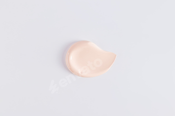 A sample, a stroke of foundation powder in a natural tone. cosmetic swatch. cosmetic texture