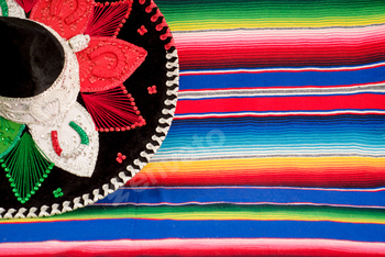 Mexican hat with the colors of the Mexican flag on a colorful serape.