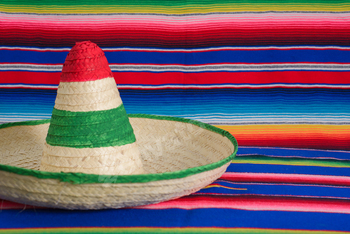 Mexican hat with the colors of the Mexican flag on a colorful serape.