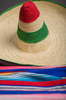 Mexican hat with the colors of the Mexican flag on a colorful serape.