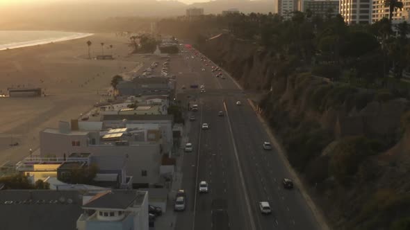 AERIAL: View of Pacific Coast Highway PCH Next To Santa Monica Pier, Los Angeles with Light Traffic