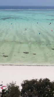 Tanzania  Vertical Video Kitesurfing Near the Shore of Zanzibar Slow Motion