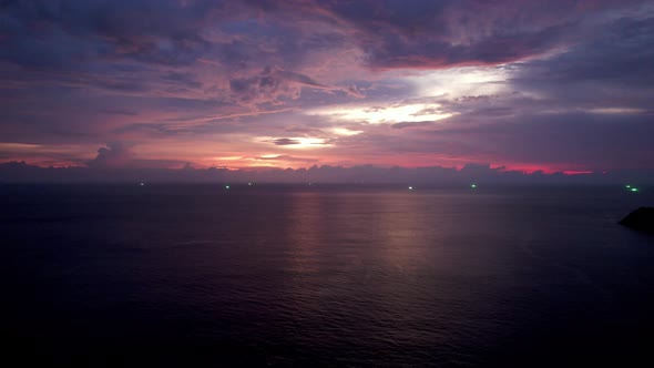 Purple Sunset with a View of the Sea and Clouds