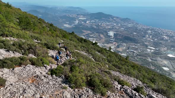 Travelers go on a hike aerial view 4 K