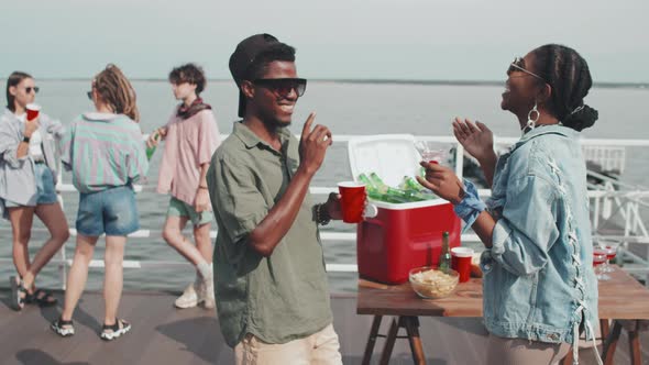 Black Couple Partying on Pier
