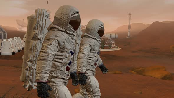 Two Astronauts Walking On The Surface Of Mars