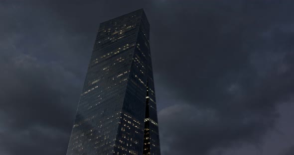 Timelapse of modern glass skyscraper in Tel Aviv, Israel with cloud relfections