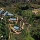 Tropical Landscape of Green Hills with Tea Plantations and Buildings - VideoHive Item for Sale