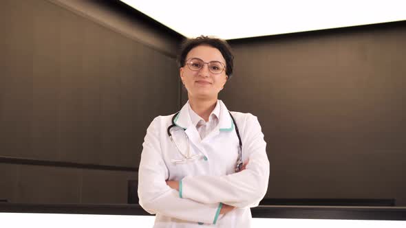 Smiling Female Physician Posing in Hospital Office