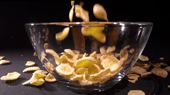 Super Slow Motion Cornflakes Falling Into a Bowl of Milk Top View