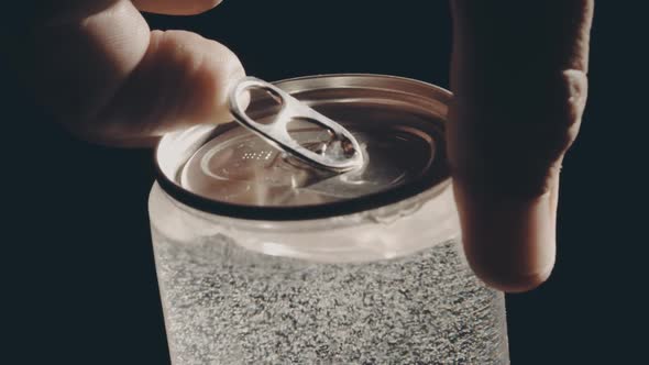 Man Opens the Transparent Beverage Can