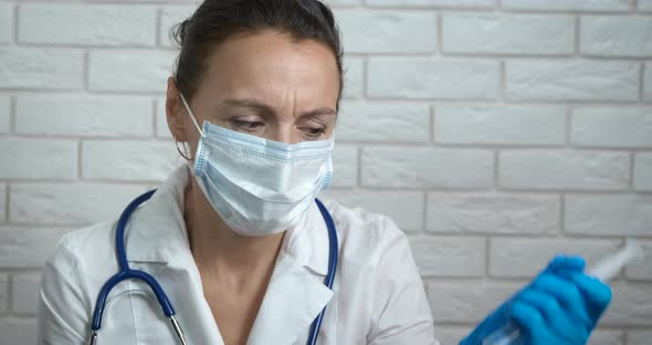 Hospital Worker with Syringe