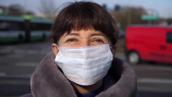 Senior Woman Wearing Medical Face Mask. Flu, Pollution, Coronavirus Concept.