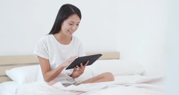 Woman Use of Tablet on Bed