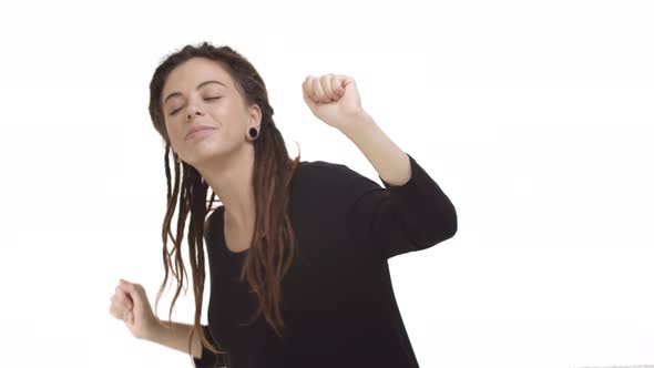 Young Carefree Hipster Girl with Dreads and Ear Tunnels Dancing and Having Fun Enjoying Party