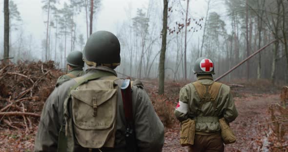 Historical Re-enactment. Re-enactors Dressed As American Soldiers Of USA Infantry Of World War II