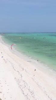 Tanzania  Vertical Video Kitesurfing Near the Shore of Zanzibar Slow Motion
