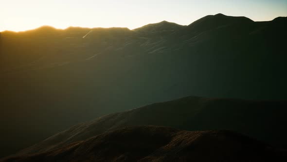 Hills with Rocks at Sunset