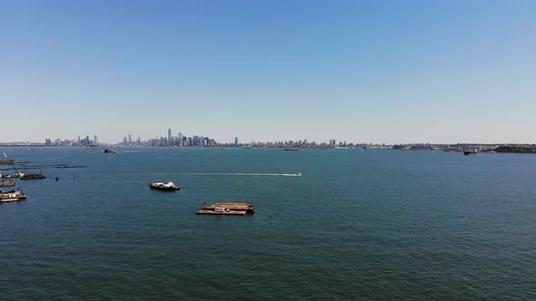 he NYC skyline is captured on a sunny day