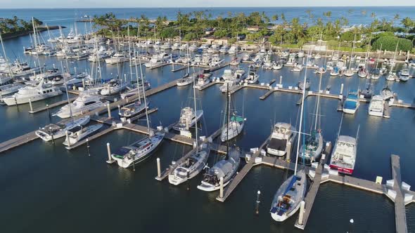 Ko Olina marina panorama, Sailing boats parked, Palm tree waterfront, Hawaii Aerial tracking