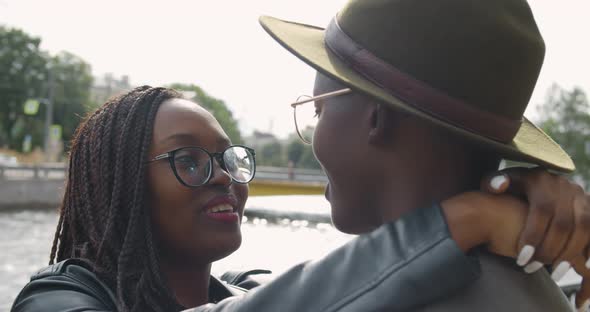 Young Afro Couple Smiling Happy and Hugging at City