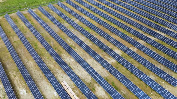 Aerial View of Solar Power Plant on Green Field