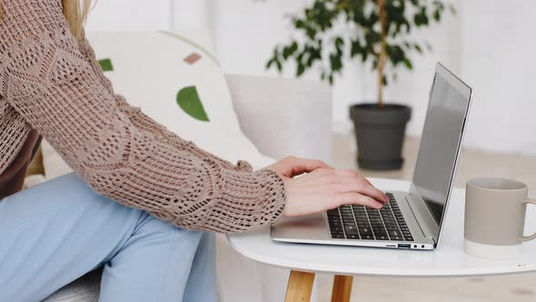 Closeup of Female Hands Fingers Typing on Modern Laptop Computer Caucasian Unrecognizable Woman