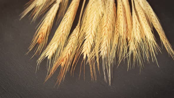 Ears of Grain on a Black Stone Table