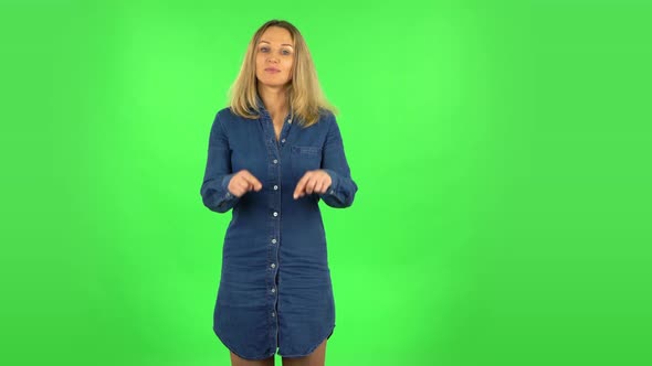 Fair Woman Is Smiling and Showing Heart with Fingers Then Blowing Kiss. Green Screen