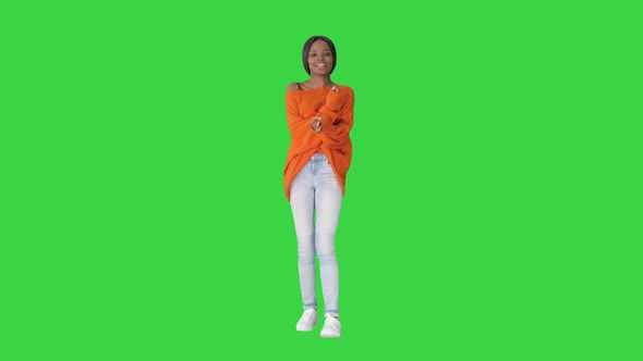 Young Casual African Woman Dancing on a Green Screen Chroma Key