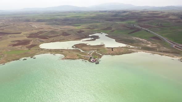 Aerial View Of Lake And Green Plains