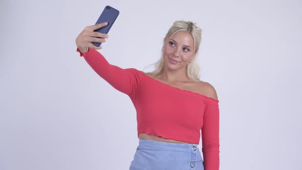 Happy Young Beautiful Blonde Woman Taking Selfie