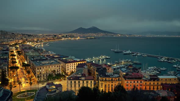 Naples (Napoli), Italy. Panorama of the Evening City. Vesuvius Volcano Is Seen in the Background