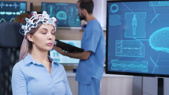 Brain Activity on Tv Screen From Female Patient with Brainwaves Scanning Headest