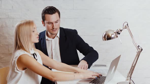 Man and woman work together in the office