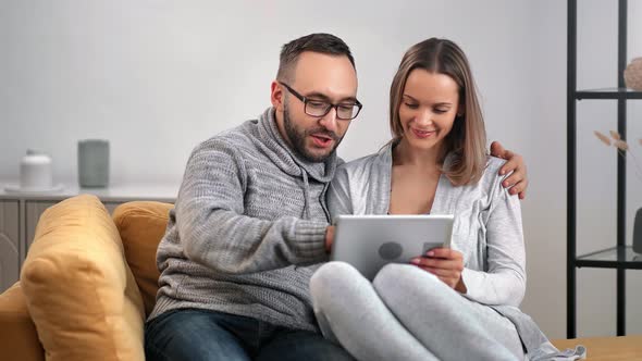 Happy Couple Smiling Talking Use Tablet Together Relaxing Comfy Couch