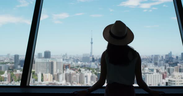 Woman look at the city of Tokyo