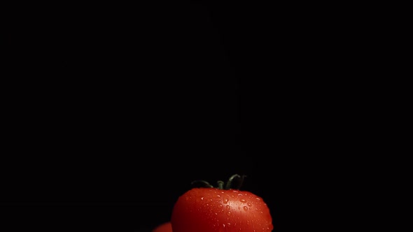 Fresh Washed Red Tomatoes on Black Background