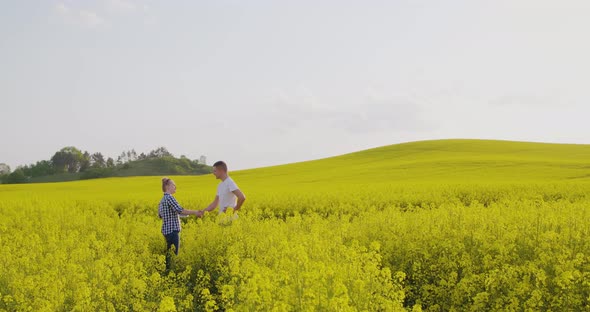 Two Farmers Working on Field Agriculture