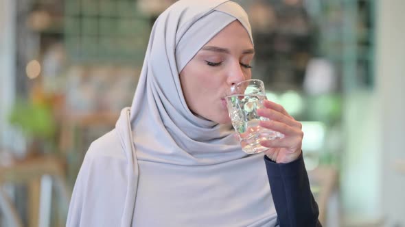 Portrait of Healthy Young Arab Woman Drinking Water