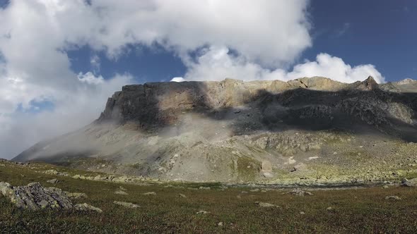 Clouds obscure the flow of clouds from the valley.