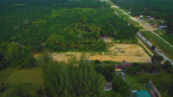 Cinematic Drone Footage of Palm Oil Mill Effluent residential consists of buildings, homes, main roa