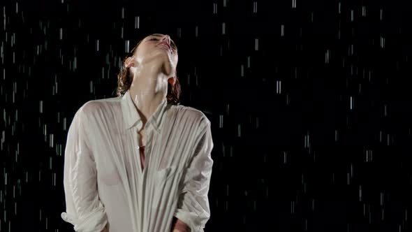 Beautiful Woman Dancing In The Rain