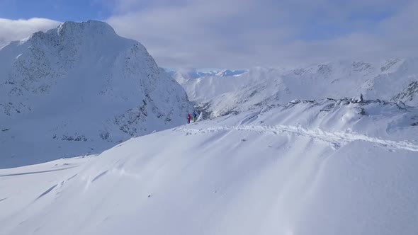 Two people ski touring in the mountains of South Tyrol