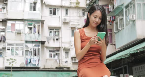 Woman use of mobile phone at outdoor 