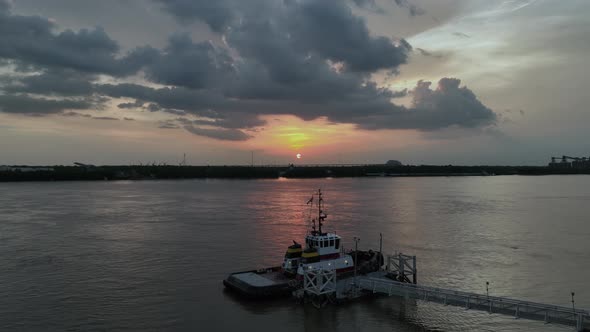 Aerial view of the Mississippi River, Tug boat and sunset